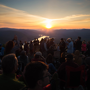 People celebrating the summer solstice on the Midnight Dome